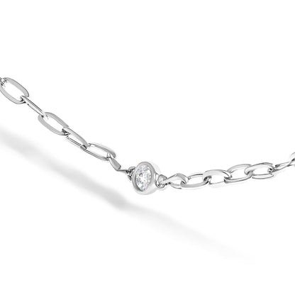 Close-up angle of a white metal necklace chain with a round white gemstone in a bezel setting, shown against a white background.