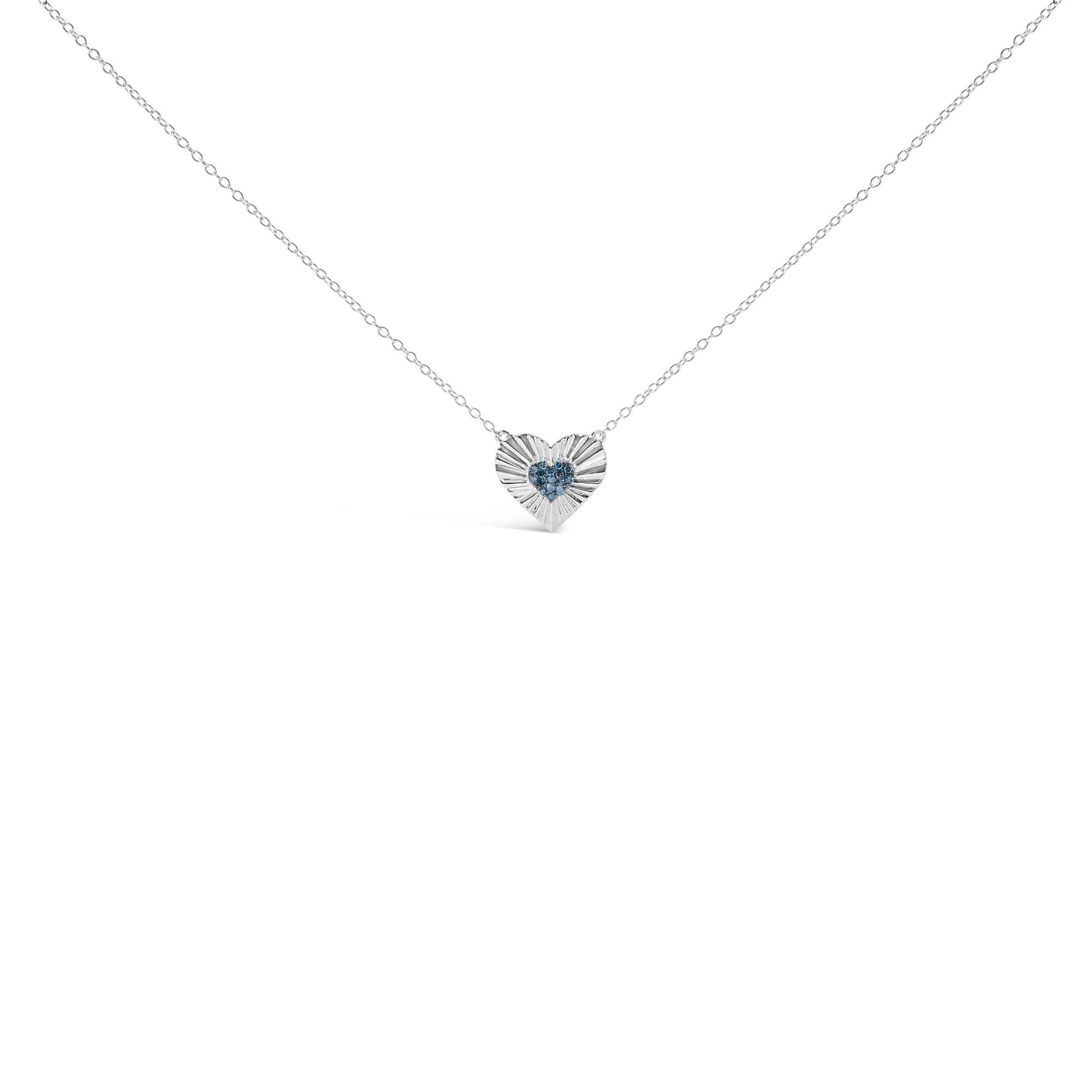 White metal necklace with heart-shaped pendant featuring blue round gemstones in prong setting, shown from front angle.