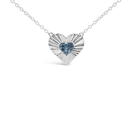 Front view of a white metal heart-shaped necklace pendant with textured rays and a cluster of round blue gemstones in the center, shown against a white background.