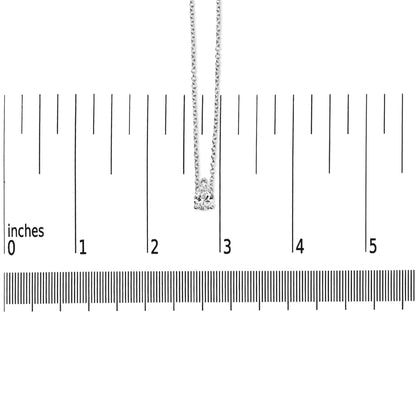 White metal necklace with a pear-shaped white gemstone pendant in prong setting, shown hanging vertically on a ruler for size reference, front view.
