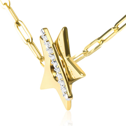 Close-up angled view of yellow metal star-shaped necklace pendant with a vertical bar set with round white gemstones in prong settings. The pendant is on a yellow metal link chain.