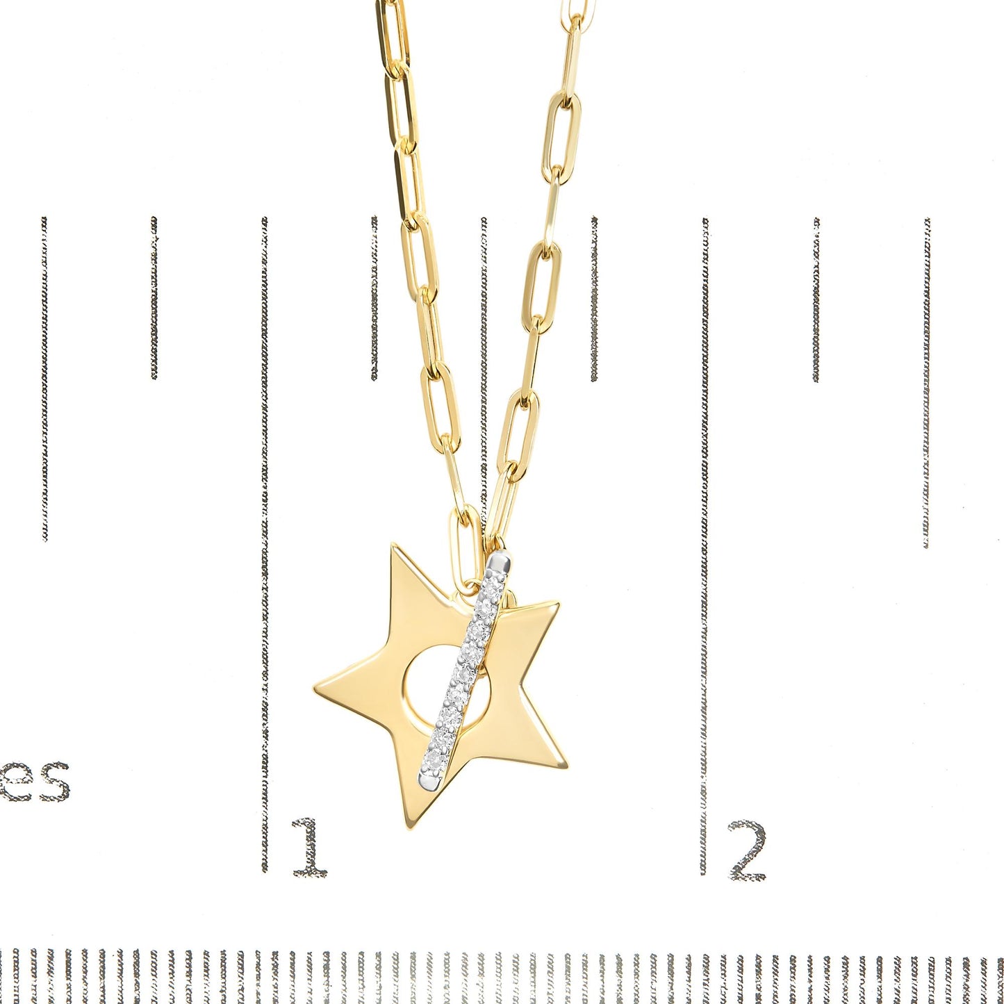 Close-up front view of a yellow metal necklace with a star-shaped pendant featuring a vertical bar set with round white gemstones, shown on a scale.