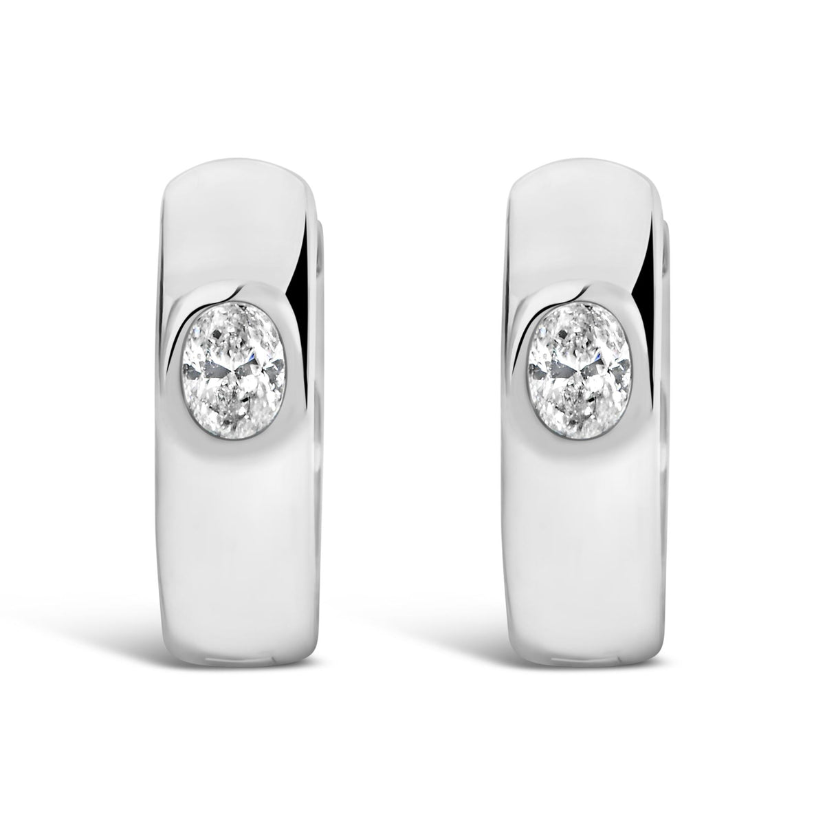 Close-up front view of white metal earrings featuring oval-shaped white gemstones in bezel settings.