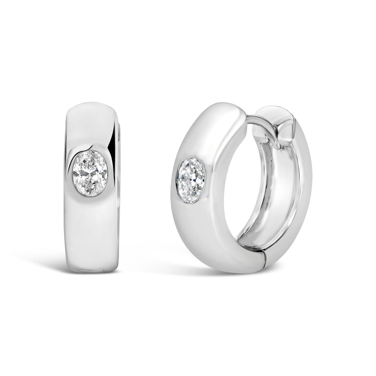Close-up front angle of white-colored hoop earrings featuring oval-shaped white gemstones set in bezel settings.