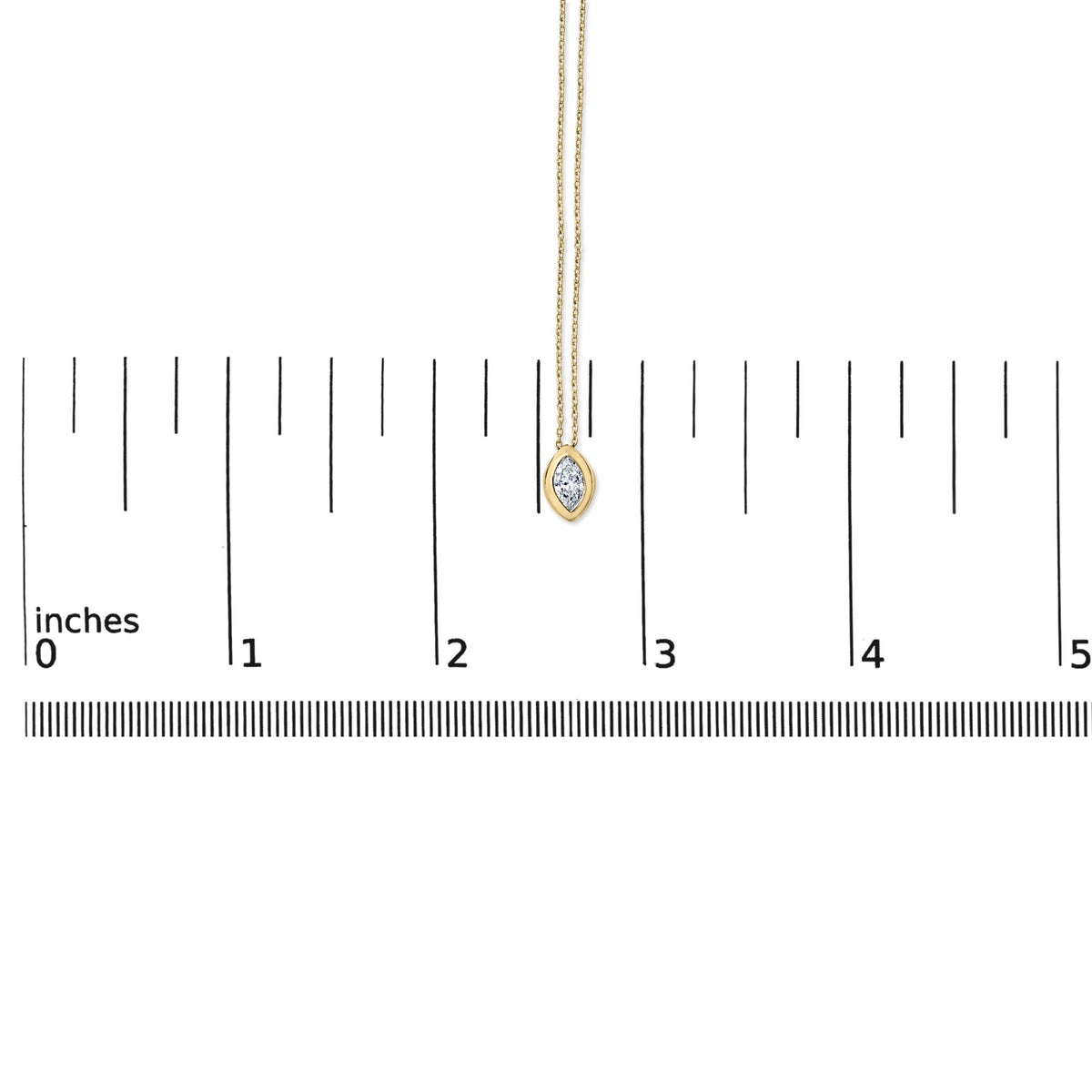 Close-up front view of a yellow necklace with a marquise-shaped white gemstone in a bezel setting, shown on a scale with inch measurements.
