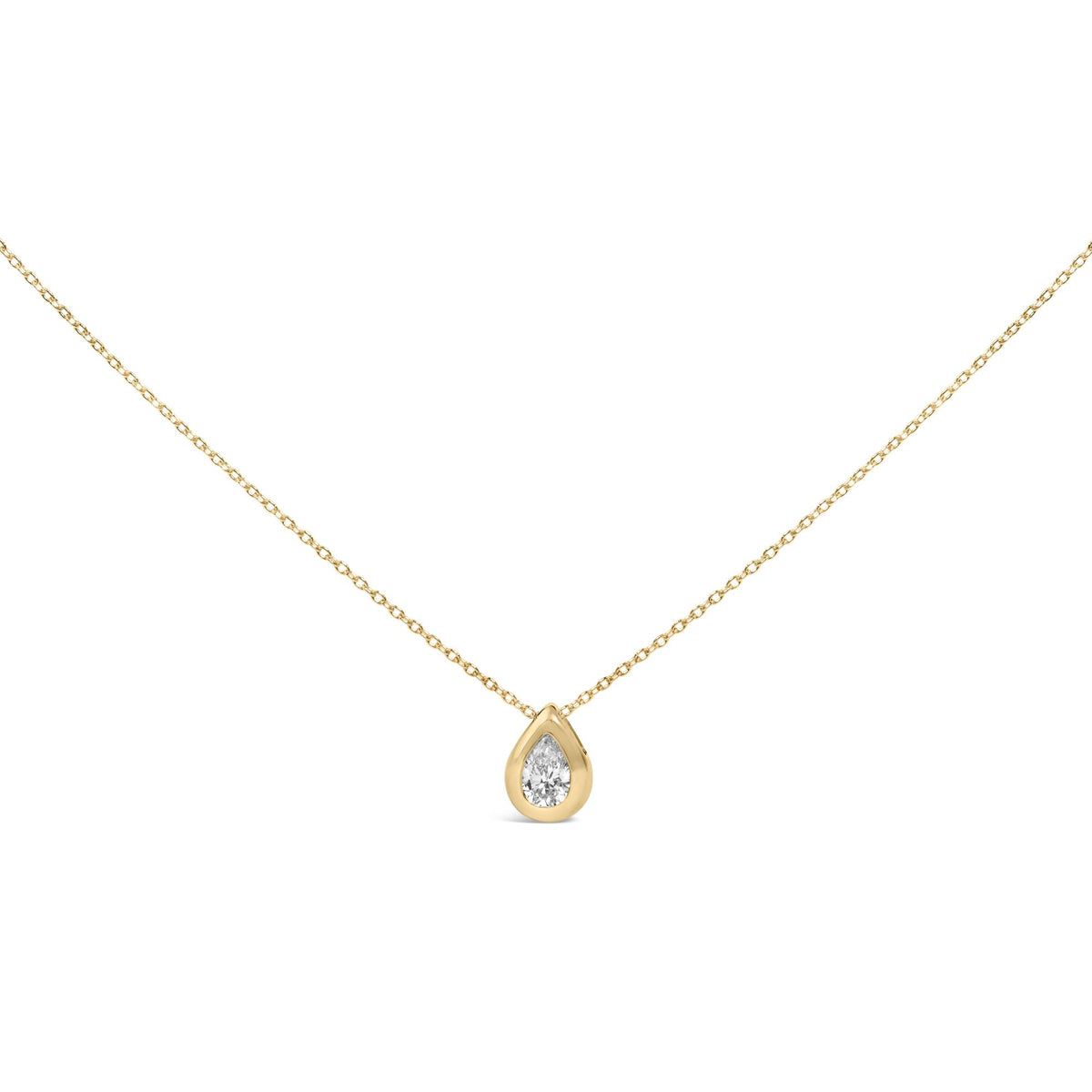 Close-up front angle of a yellow metal necklace with a single pear-shaped white gemstone in a bezel setting.