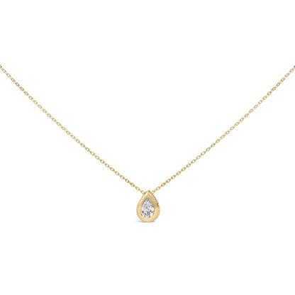Close-up front angle of a yellow metal necklace with a single pear-shaped white gemstone in a bezel setting.