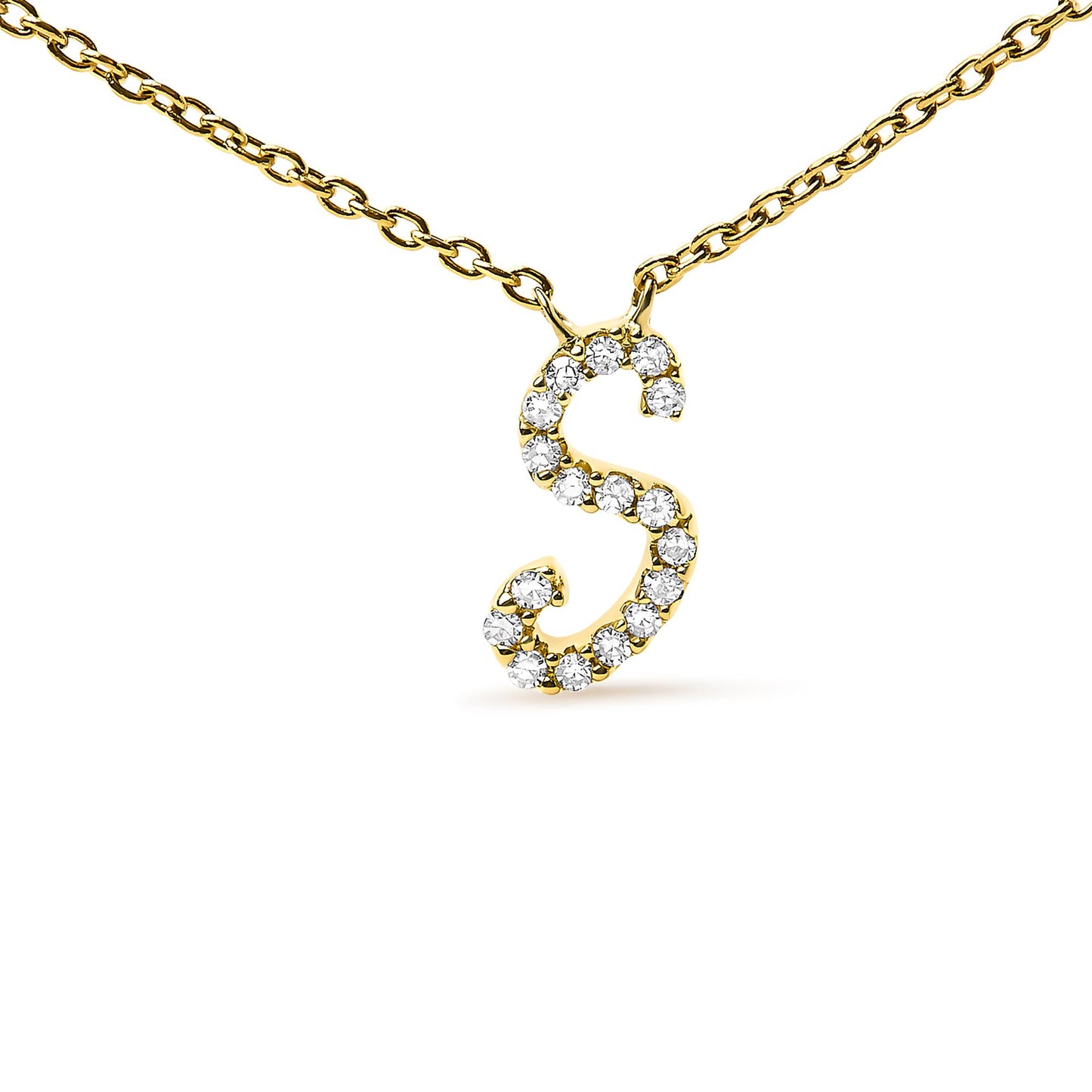 Close-up front view of a yellow metal necklace featuring an 'S' shaped pendant set with multiple round white gemstones in a micro-pave setting.