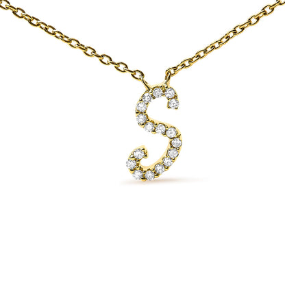 Close-up front view of a yellow metal necklace featuring an 'S' shaped pendant set with multiple round white gemstones in a micro-pave setting.