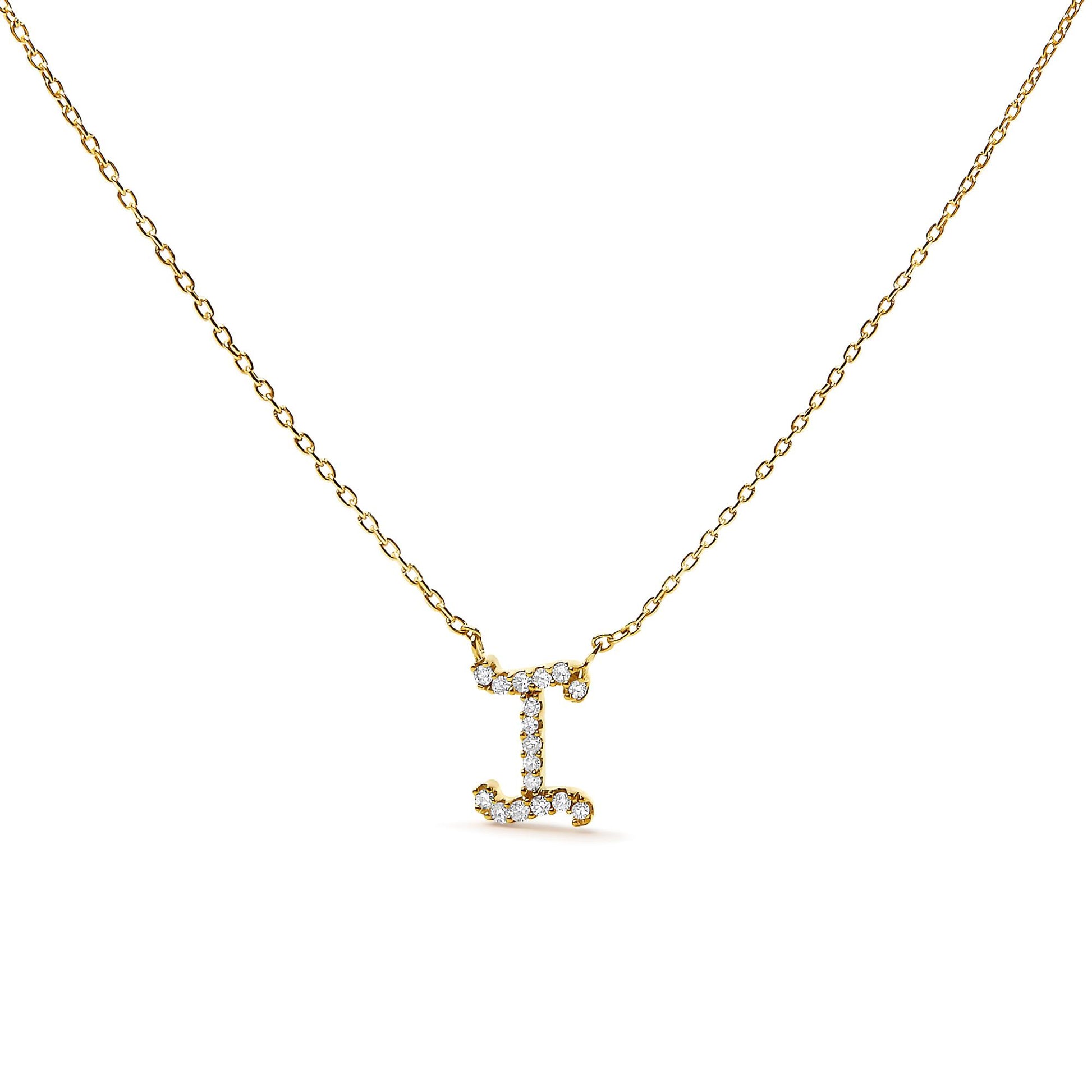 Front angle view of a yellow metal necklace with a pendant shaped like the letter I encrusted with round white gemstones in micro-pave setting.