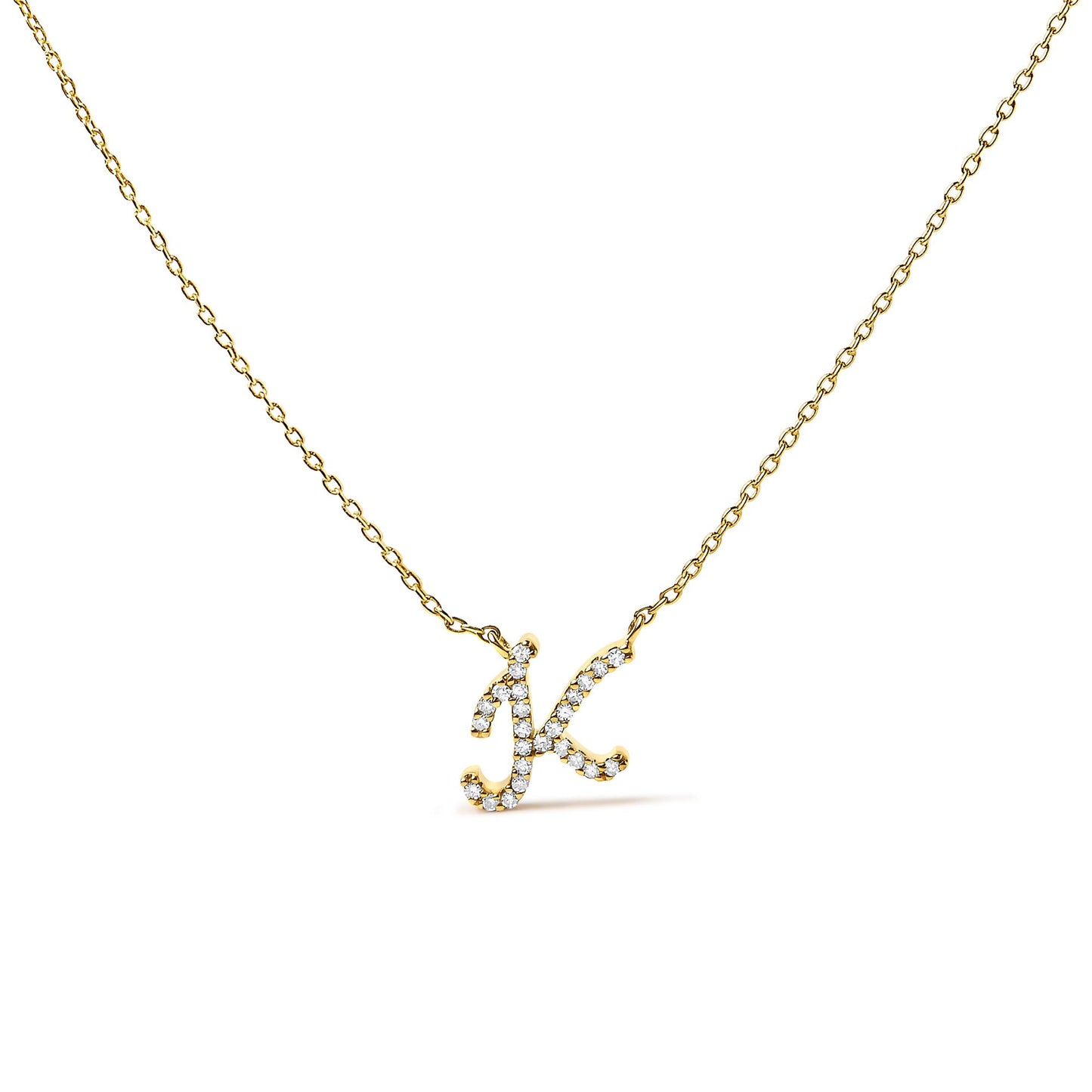 Close-up front angle of a yellow metal necklace with a pendant in the shape of the letter 'K,' featuring round white gemstones in a micro-pave setting.