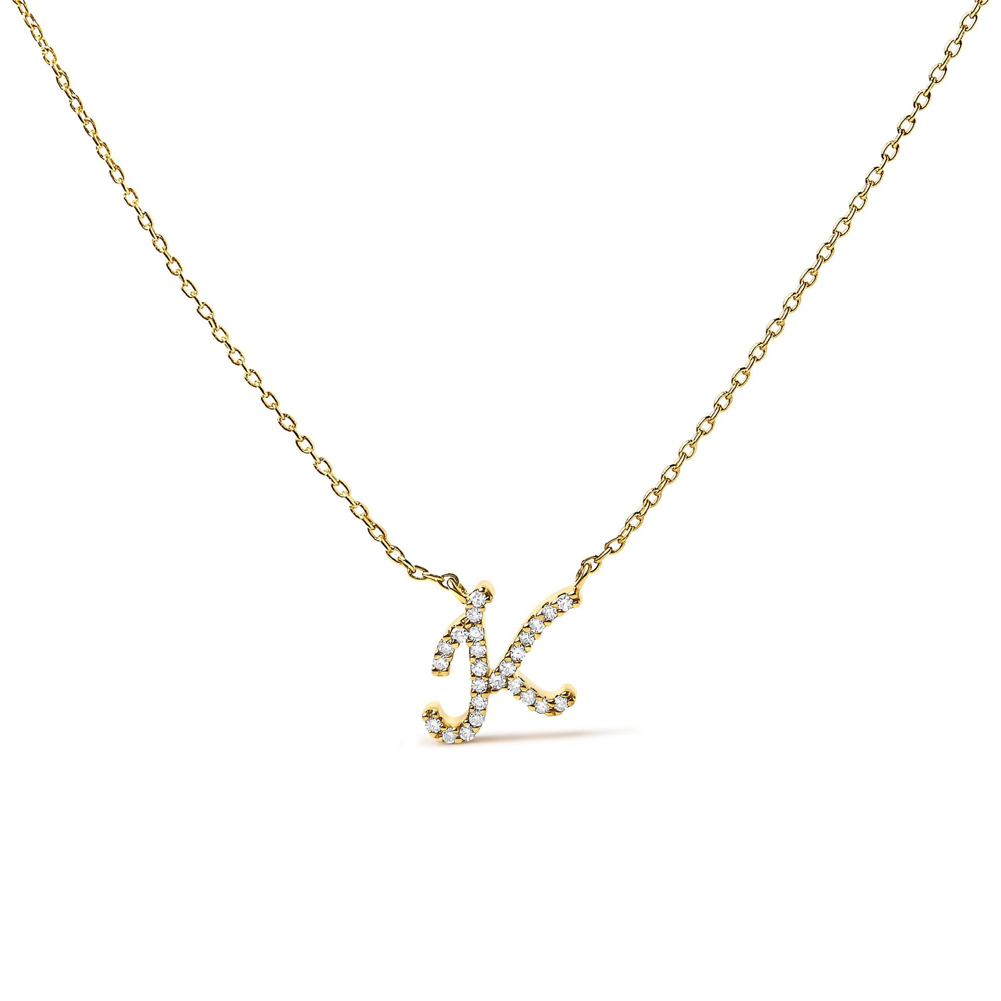Close-up front angle of a yellow metal necklace with a pendant in the shape of the letter 'K,' featuring round white gemstones in a micro-pave setting.