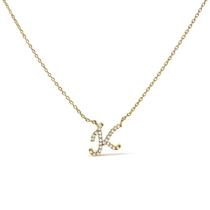 Close-up front angle of a yellow metal necklace with a pendant in the shape of the letter 'K,' featuring round white gemstones in a micro-pave setting.
