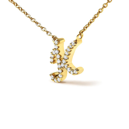 Close-up front angled view of a yellow necklace pendant shaped like the letter 'K' adorned with round white gemstones in a micro-pave setting, suspended from a matching yellow chain.