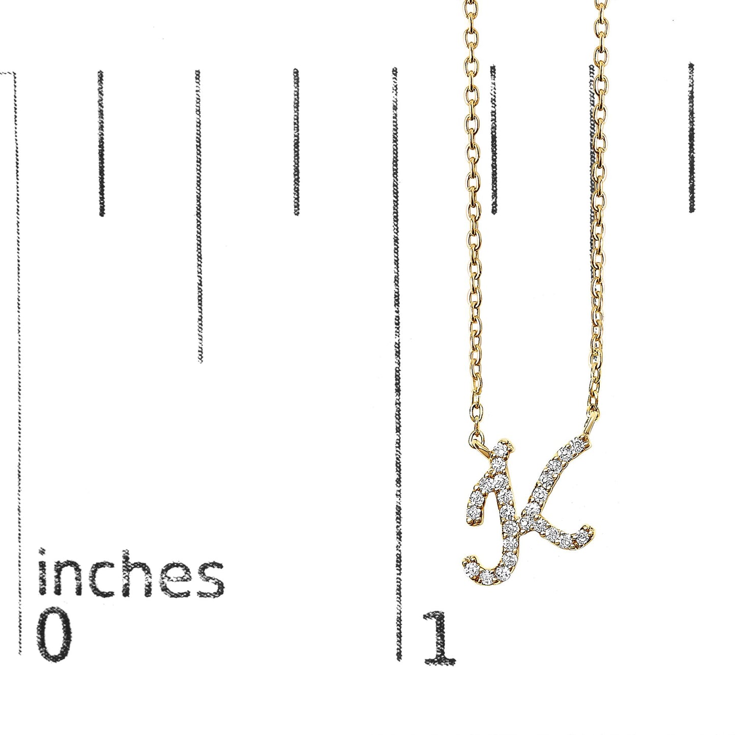 Close-up front view of a yellow metal necklace with a pendant shaped as the letter 'K,' adorned with white round gemstones in a micro-pave setting, shown on a measurement scale.