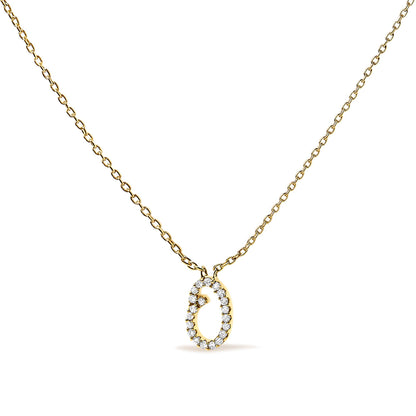 Yellow metal necklace with an oval-shaped pendant set with small white gemstones in a micro-pave setting, shown from a front angle on a white background.