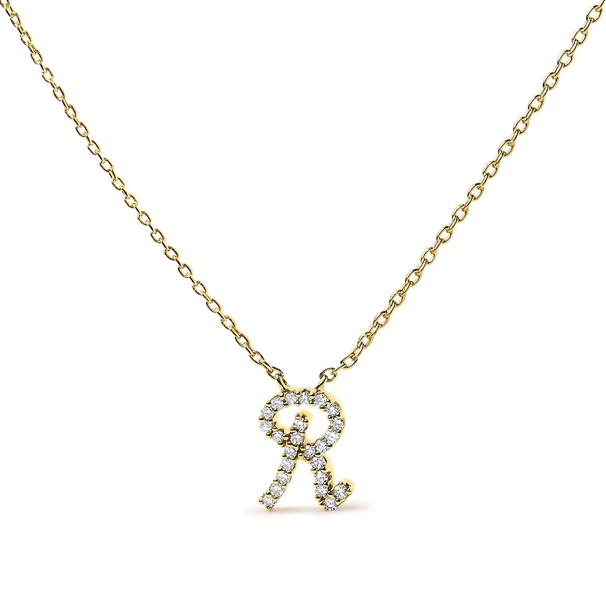 Front-facing close-up of a yellow metal necklace with a pendant shaped like the letter 'R' adorned with small white gemstones in a micro-pave setting.