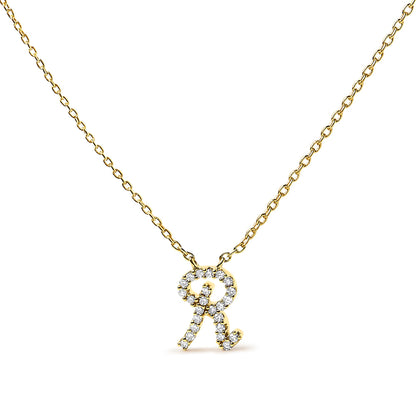 Front-facing close-up of a yellow metal necklace with a pendant shaped like the letter 'R' adorned with small white gemstones in a micro-pave setting.