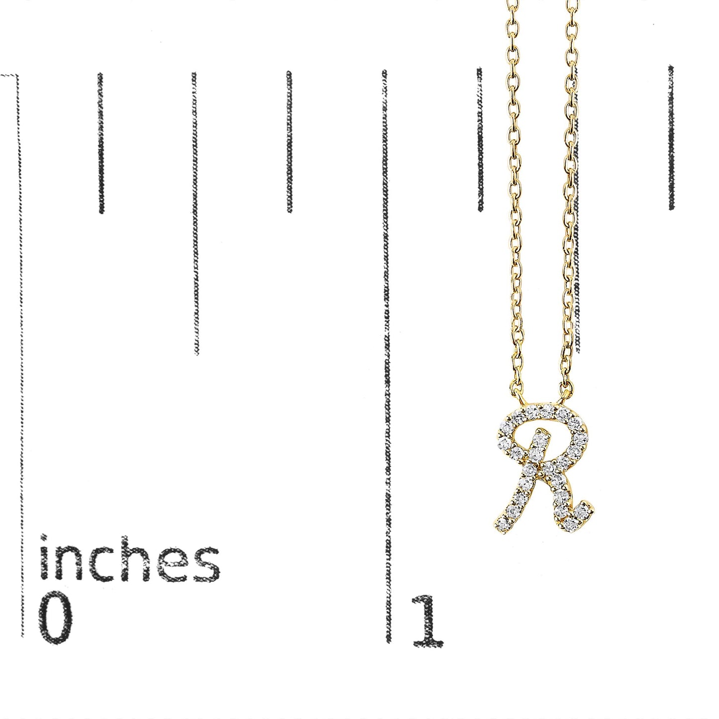 Close-up front view of a yellow necklace with a pendant shaped like the letter 'R' adorned with small white gemstones, shown on a measurement scale.