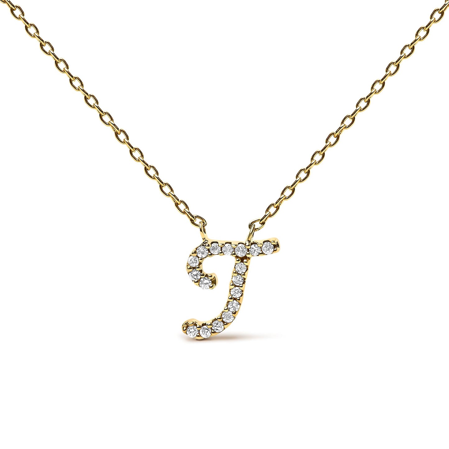 Close-up front view of a yellow metal necklace with a pendant in the shape of the letter 'J' adorned with small round white gemstones in a micro-pave setting.