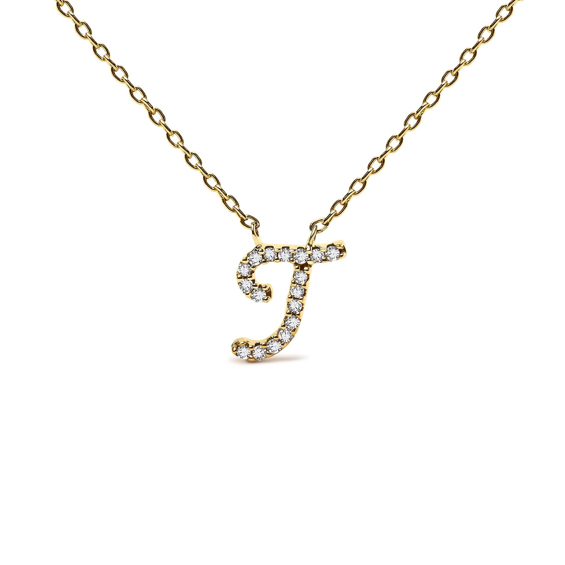 Close-up front angle of a yellow metal necklace with a pendant shaped like the letter 'J' adorned with round white gemstones in a micro-pave setting.
