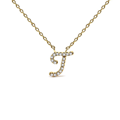 Close-up front angle of a yellow metal necklace with a pendant shaped like the letter 'J' adorned with round white gemstones in a micro-pave setting.