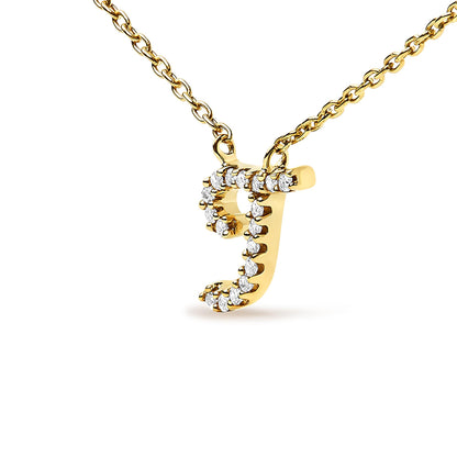 Close-up front angle of a yellow metal necklace with a lowercase letter 'j' pendant adorned with round white gemstones in a micro-pave setting.