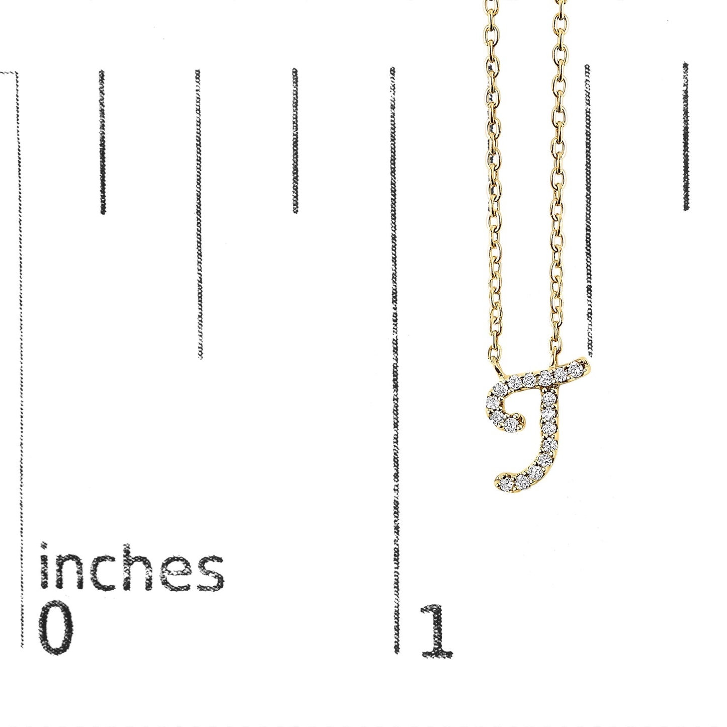 Yellow metal necklace with a pendant in the shape of the letter 'J' adorned with round white gemstones in a micro-pave setting, shown hanging on a scale with inch measurements, front view.