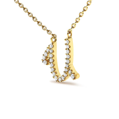 Close-up front angle of a yellow metal necklace pendant shaped like the letter 'U' adorned with round white gemstones in a micro-pave setting, shown on a white background.