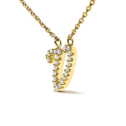 Close-up front angle of a yellow metal necklace pendant in the shape of a letter 'V,' outlined with round white gemstones in a micro-pave setting, shown against a white background.