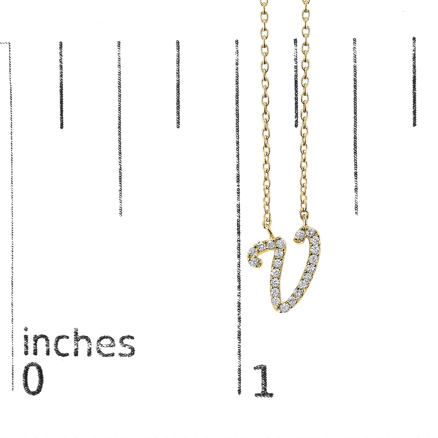Close-up front view of a yellow necklace pendant shaped like the letter V, adorned with round white gemstones in a micro-pave setting, shown hanging on a scale.