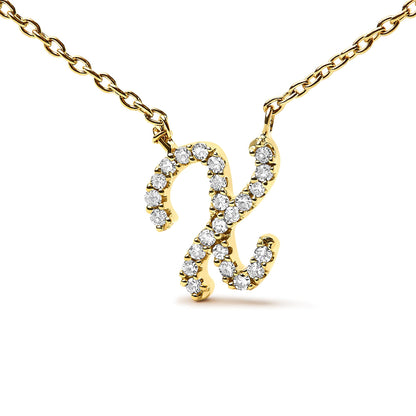 Close-up front angle of a yellow metal necklace pendant in a script letter shape adorned with white round gemstones in a micro-pave setting, shown isolated on a white background.