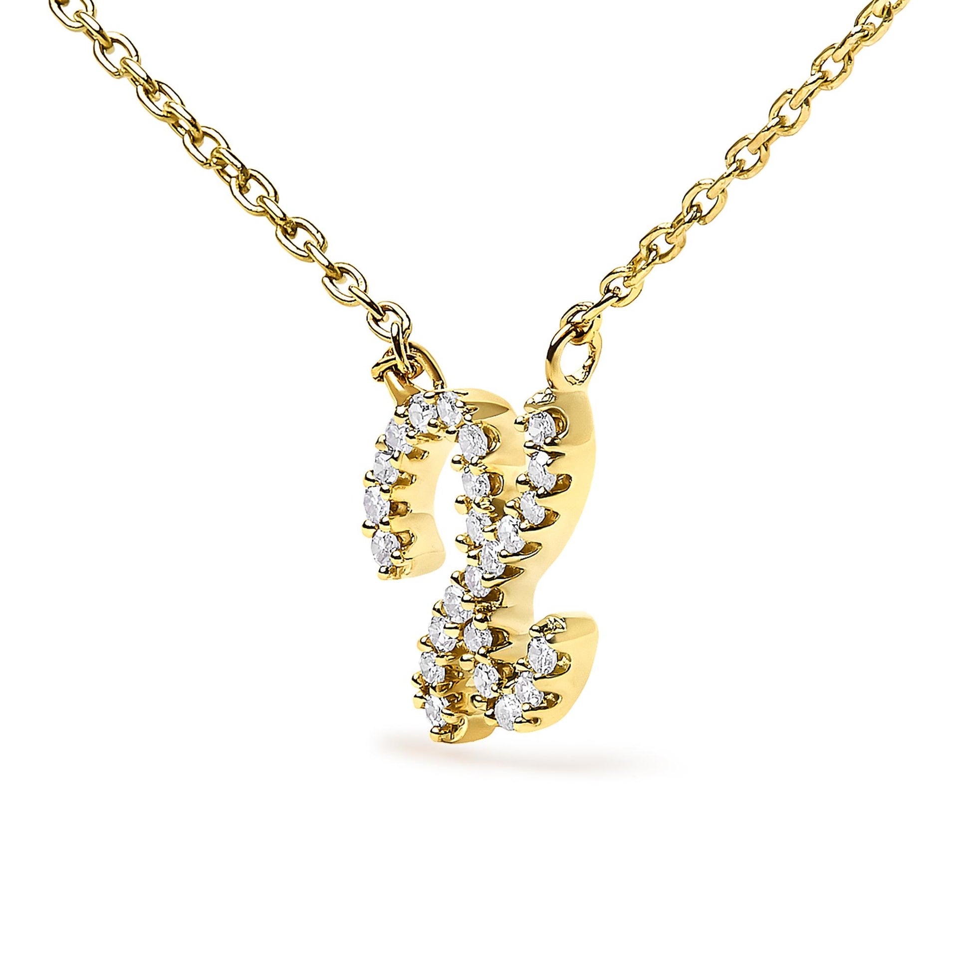 Close-up front angle of a yellow metal necklace pendant shaped like the letter 'Z,' adorned with round white gemstones in a micro-pave setting, shown on a white background.