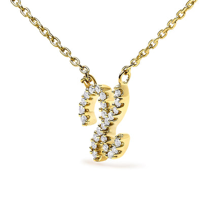 Close-up front angle of a yellow metal necklace pendant shaped like the letter 'Z,' adorned with round white gemstones in a micro-pave setting, shown on a white background.