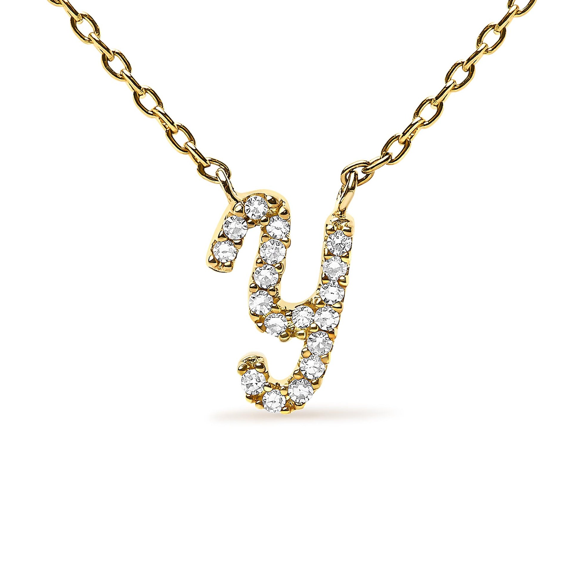 Close-up front view of a yellow metal necklace with a lowercase letter 'y' pendant set with round white gemstones in a micro-pave setting.
