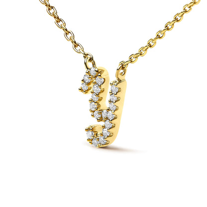 Close-up front angle of a yellow metal necklace pendant in the shape of the letter 'y' adorned with white round gemstones in a micro-pave setting.
