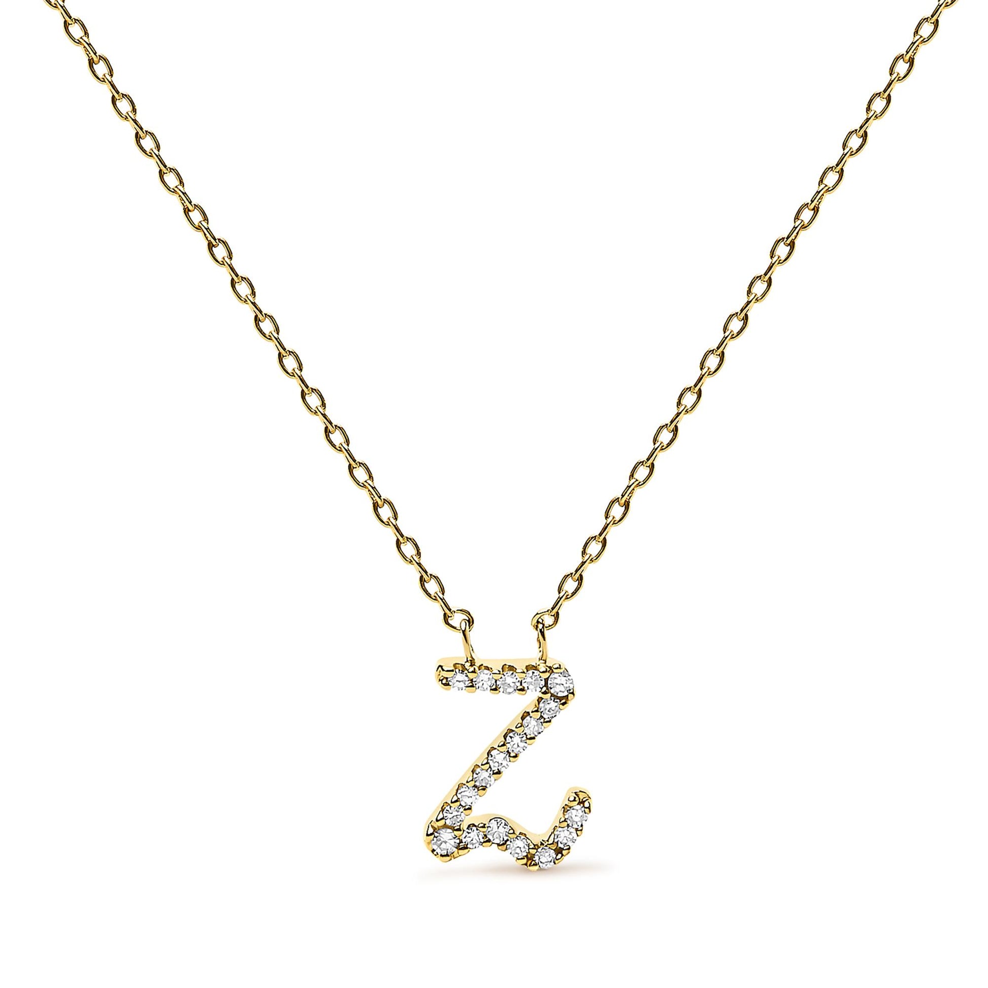Front-facing close-up of a yellow metal necklace with a pendant shaped like the letter 'Z,' adorned with small round white gemstones in a micro-pave setting.