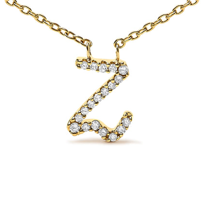 Close-up front view of a yellow metal necklace pendant in the shape of the letter Z, adorned with round white gemstones in a micro-pave setting, displayed on a white background.