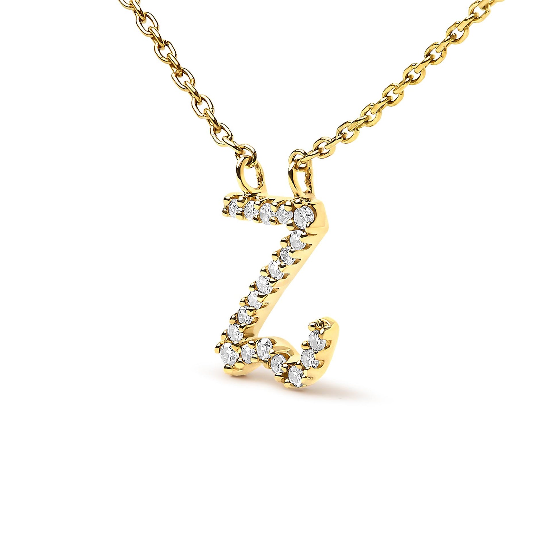 Close-up front view of a yellow metal necklace pendant shaped like the letter Z, featuring a micro-pave setting of round white gemstones along the letter's outline.