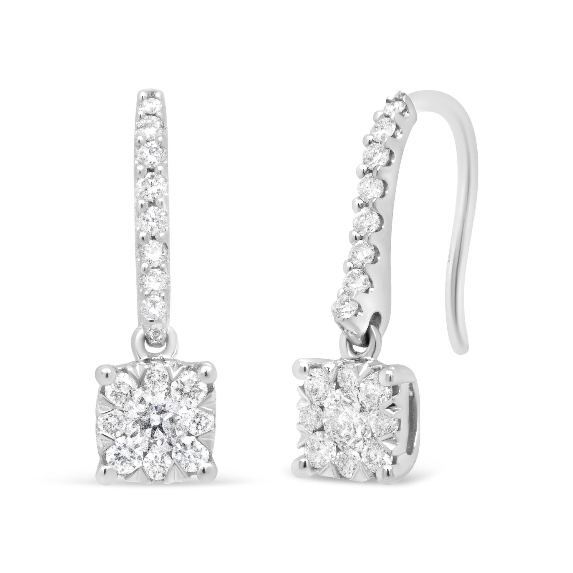 Front and side view of white metal drop earrings with pave and prong-set round white gemstones on the hook and cluster of round white gemstones at the base, shown on a white background.