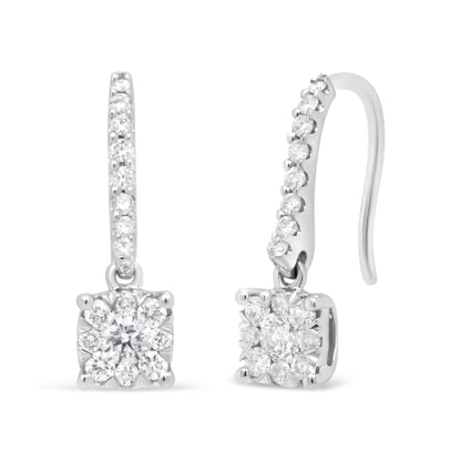 Front and side view of white metal drop earrings with pave and prong-set round white gemstones on the hook and cluster of round white gemstones at the base, shown on a white background.
