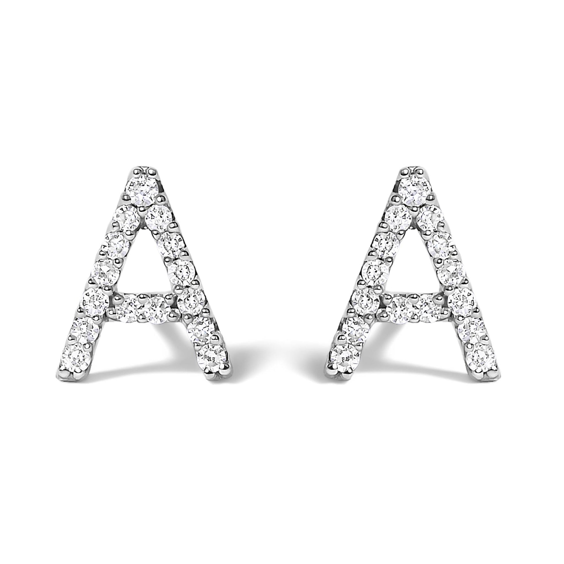 Close-up front view of a pair of white metal earrings shaped like the letter A, adorned with round white gemstones in a micro-pave setting.