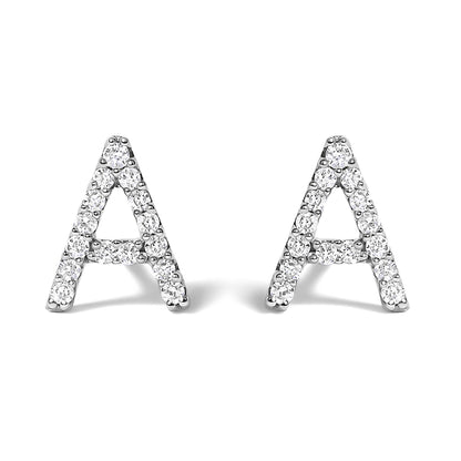 Close-up front view of a pair of white metal earrings shaped like the letter A, adorned with round white gemstones in a micro-pave setting.