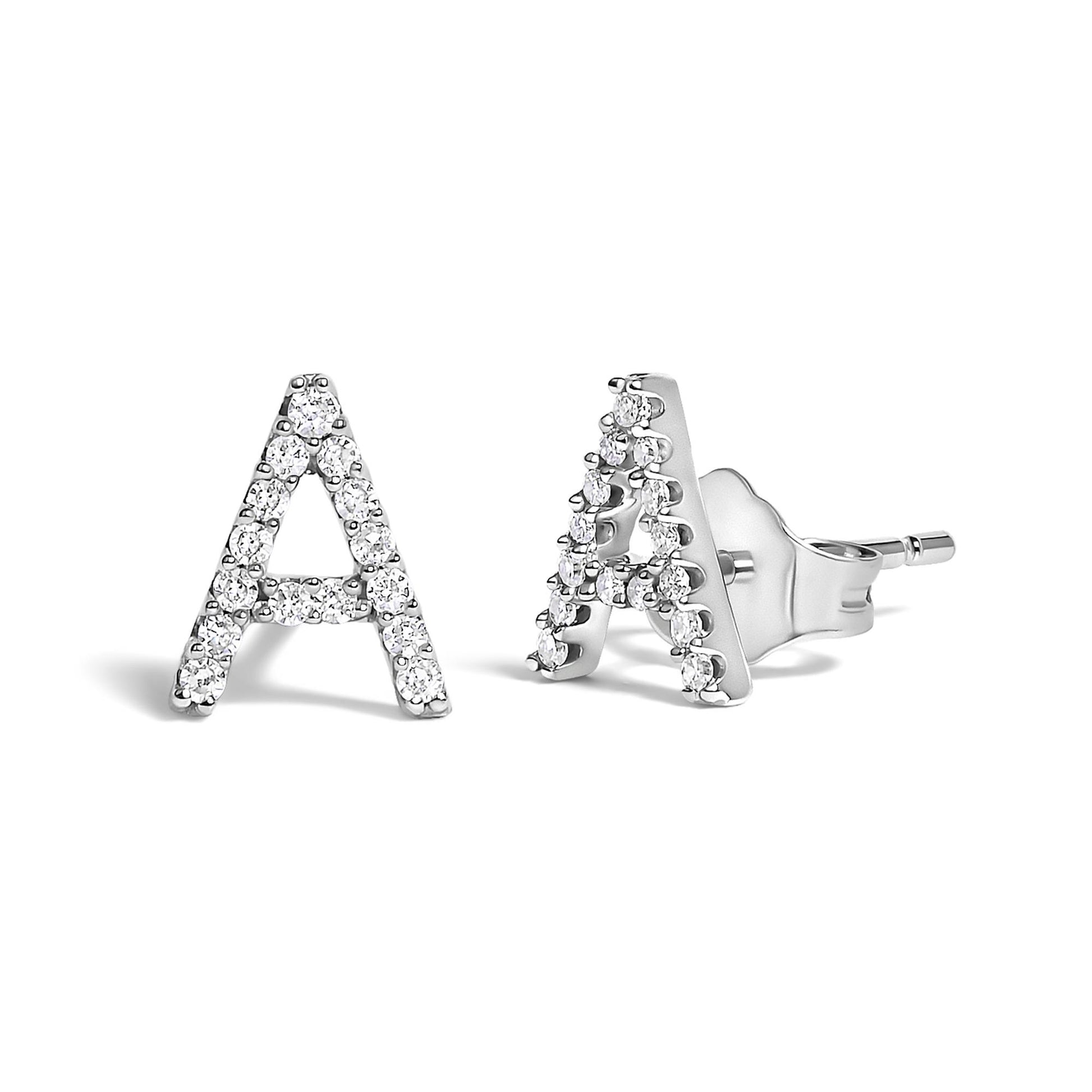 Pair of white metal stud earrings shaped as the letter A, adorned with round white gemstones in a micro-pave setting, shown from a front and side angled view on a white background.