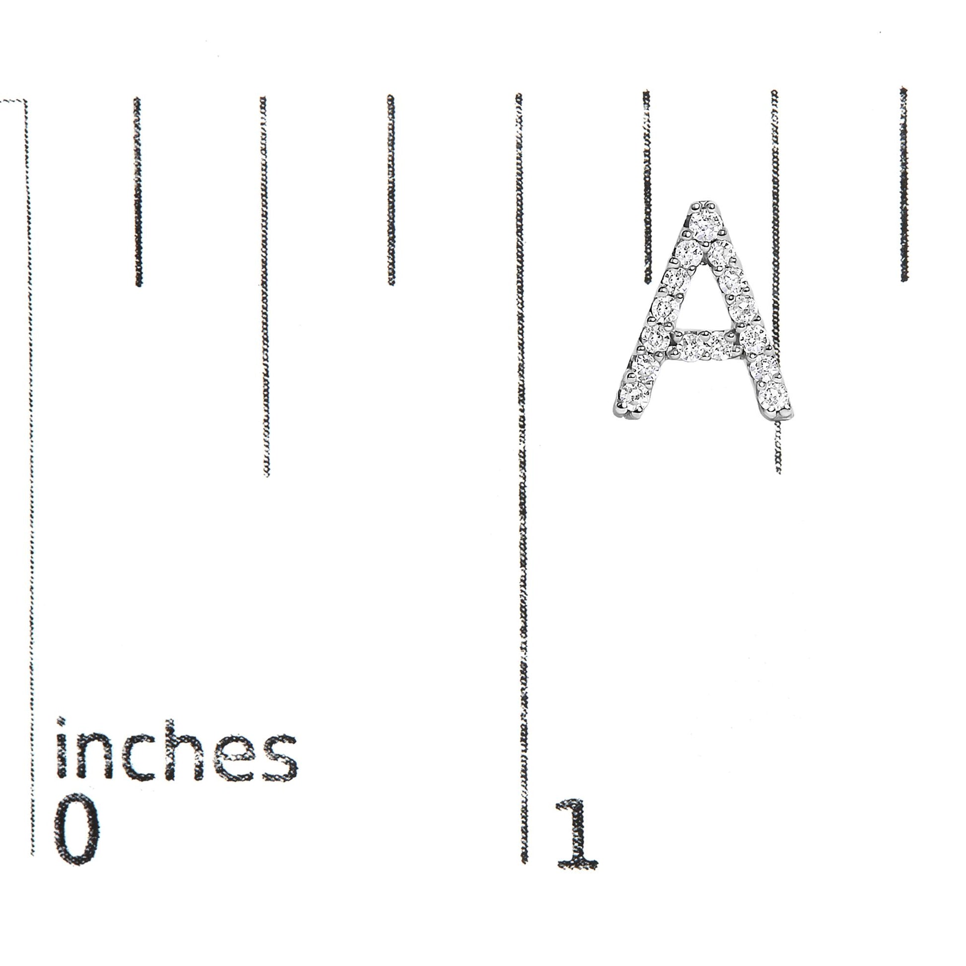 Close-up front angle of a white metal letter A earring with round white gemstones in a micro-pave setting, shown on a scale.