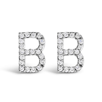 Front view of white metal earrings shaped as the letter B, adorned with round white gemstones in a micro-pave setting.