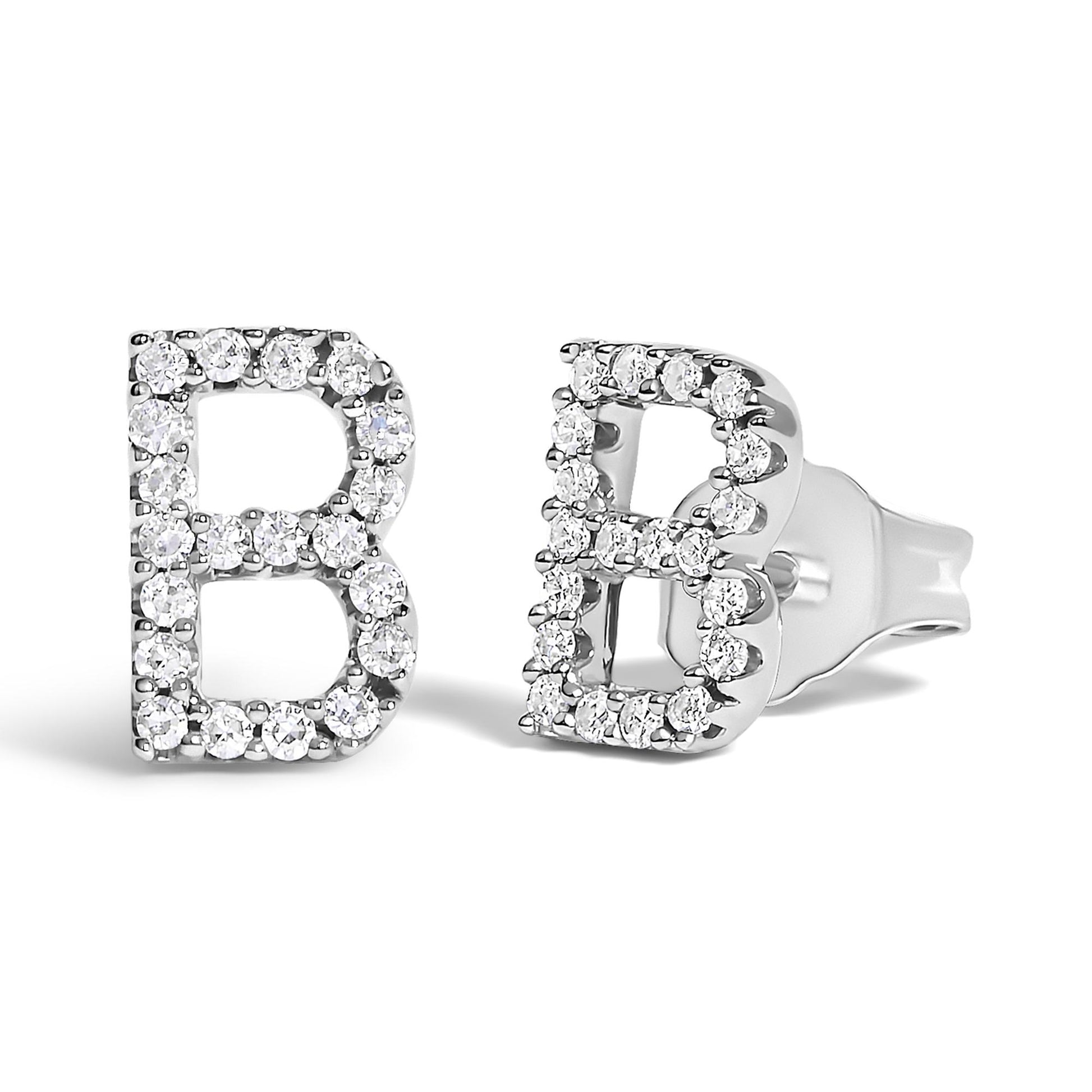 Close-up front and side angle view of white metal earrings shaped like the letter B, adorned with round white gemstones in a micro-pave setting, shown on a white background.