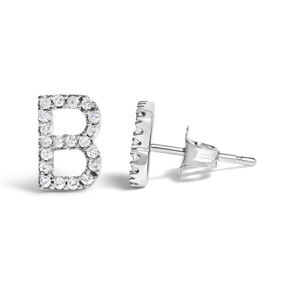 Close-up side and front angled shot of white metal stud earrings shaped like the letter B, featuring round white gemstones in a micro-pave setting.