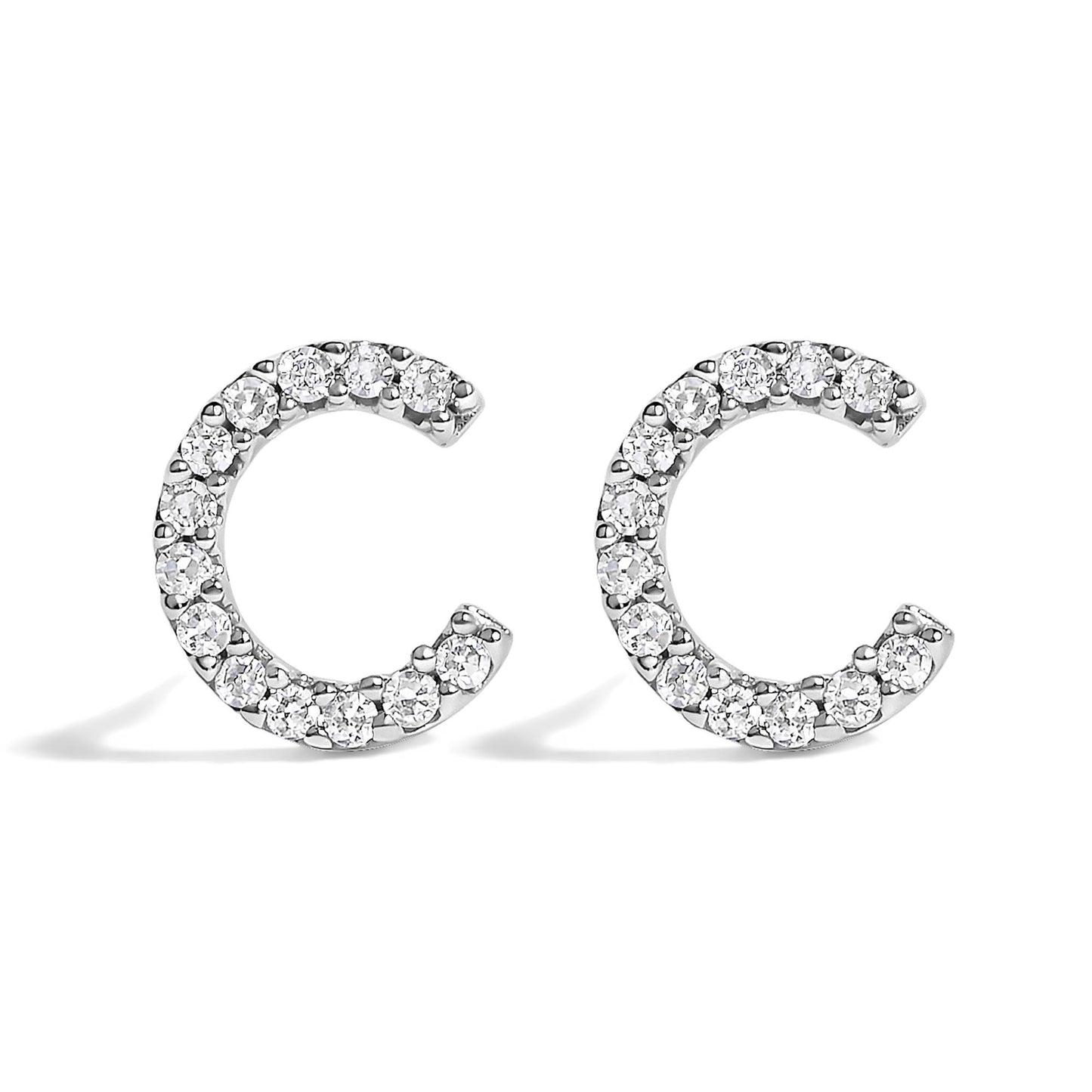 Pair of white metal open hoop earrings set with round white gemstones in micro-pave setting, shown from a front angle on a white background.