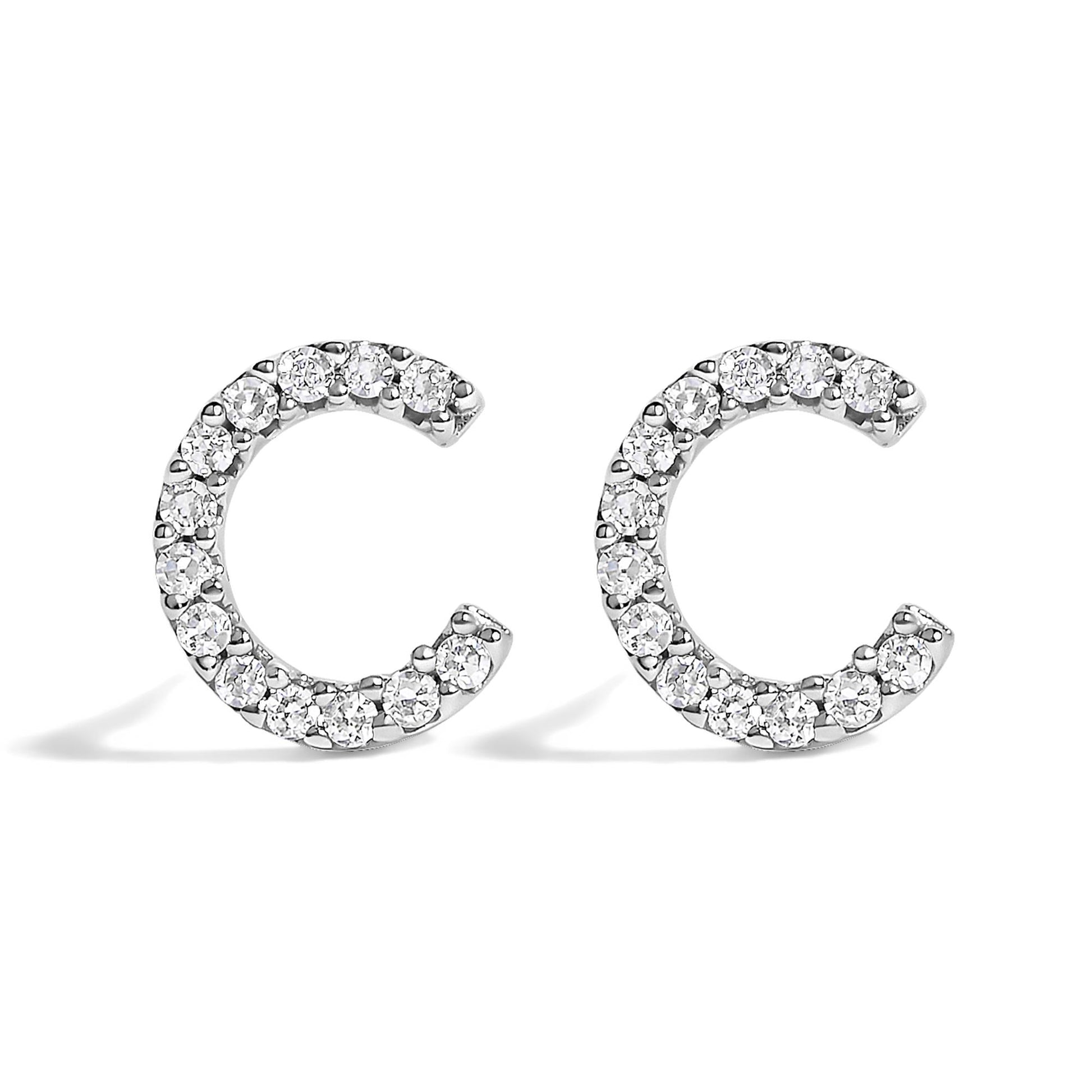 Pair of white metal open hoop earrings set with round white gemstones in micro-pave setting, shown from a front angle on a white background.